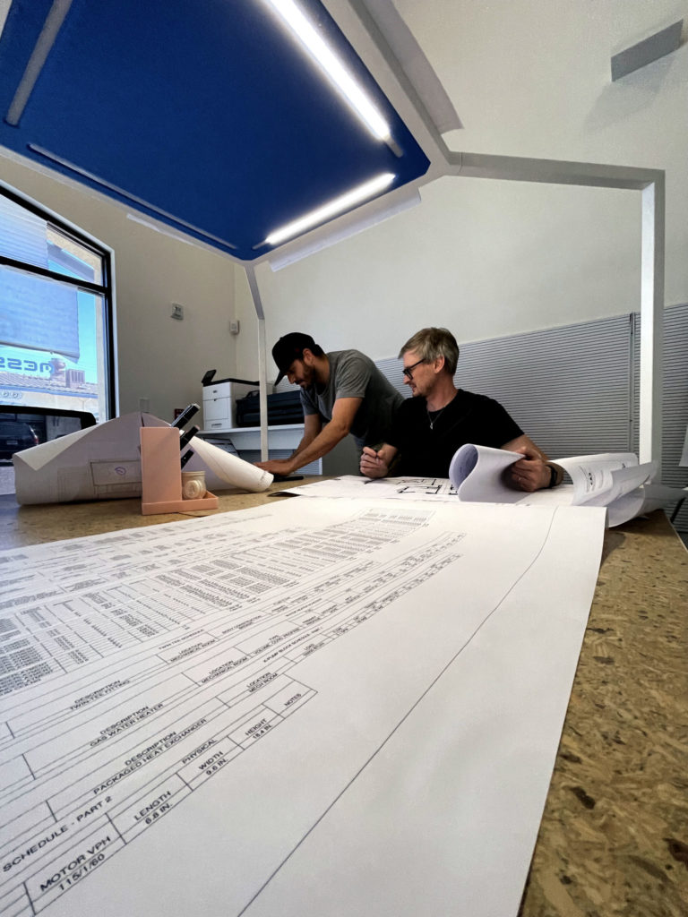 Our co-founder, Francesco Marchesi, and our senior engineer, Bryan Rossi, hard at work on panel, control, zoning, or mechanical layouts!