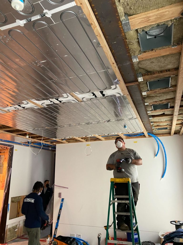 The team at Doke's Plumbing installing our new Ray Magic® NK radiant cooling and heating ceiling panels.