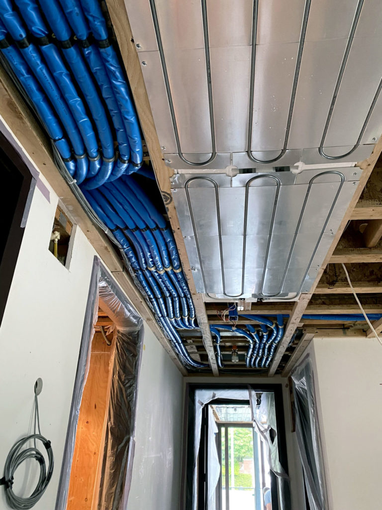 Messana radiant ceiling for heating and cooling. Hot or cold water is delivered via pre-insulated PEX piping lines.