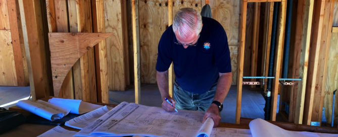 Ed Kline of Kline's Kustom Heating and Air reviewing hydronics plans.