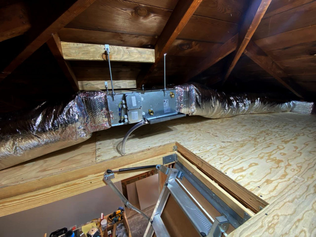 Jaga hydronic fan coil installed in an attic.