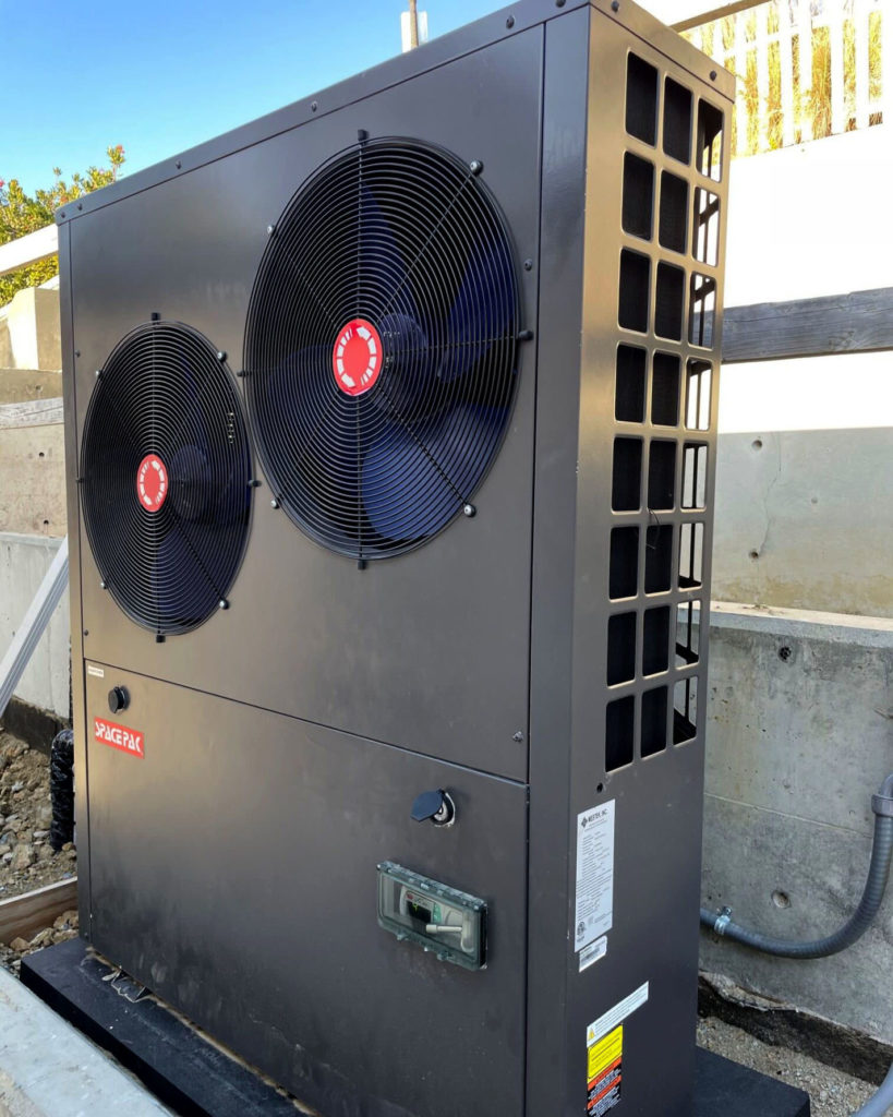 SpacePak air-to-water heat pump that is used to generate hot and cold water for use within Jaga hydronic fan coils which provide both heating and cooling.