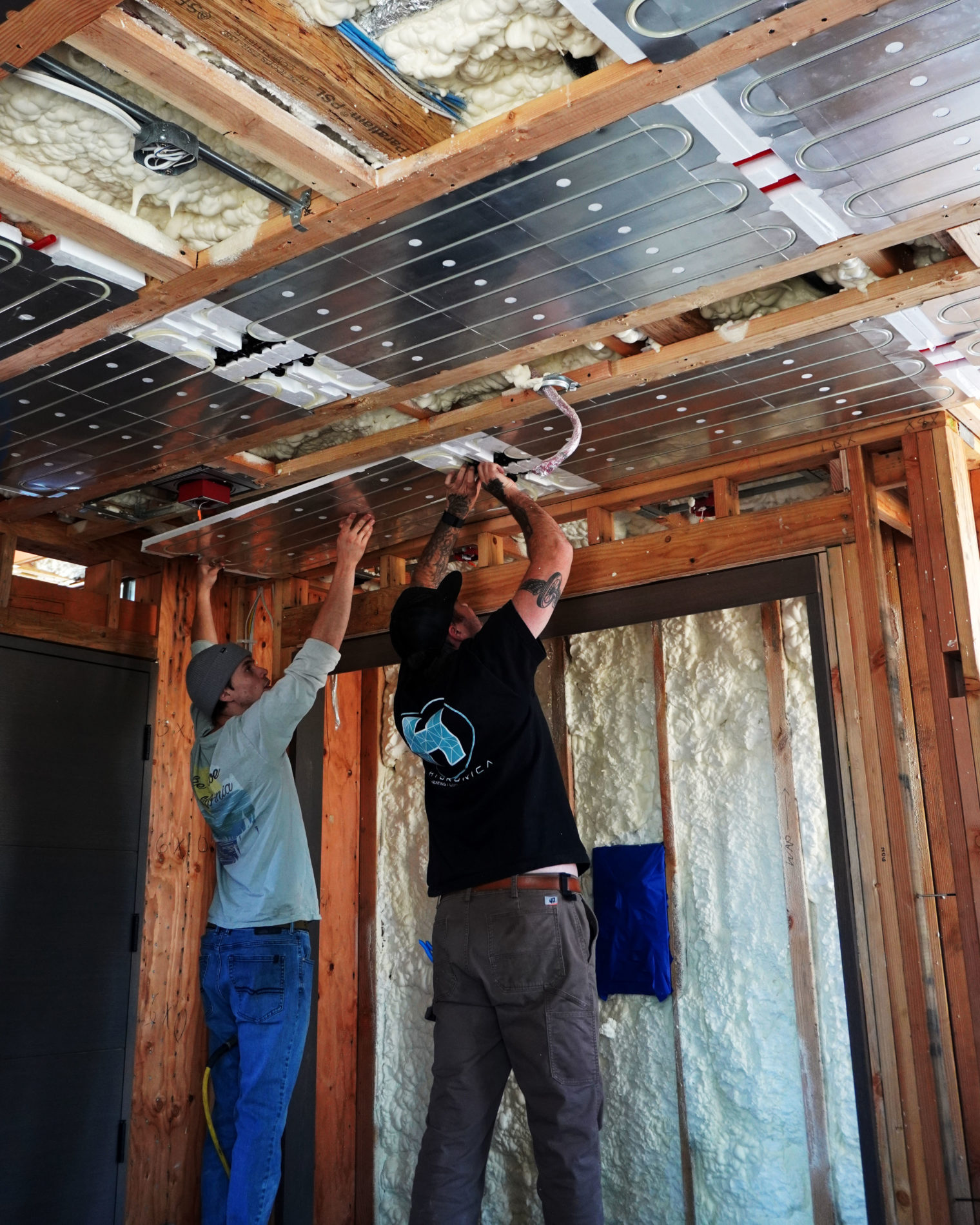 Hydronica team installing our Ray Magic® radiant cooling and heating ceiling panels.