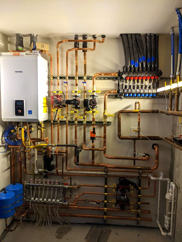 Wong 1 Mech Room Mechanical room for a complex hydronic system that provides radiant cooling via a Messana Ray Magic® radiant ceiling.