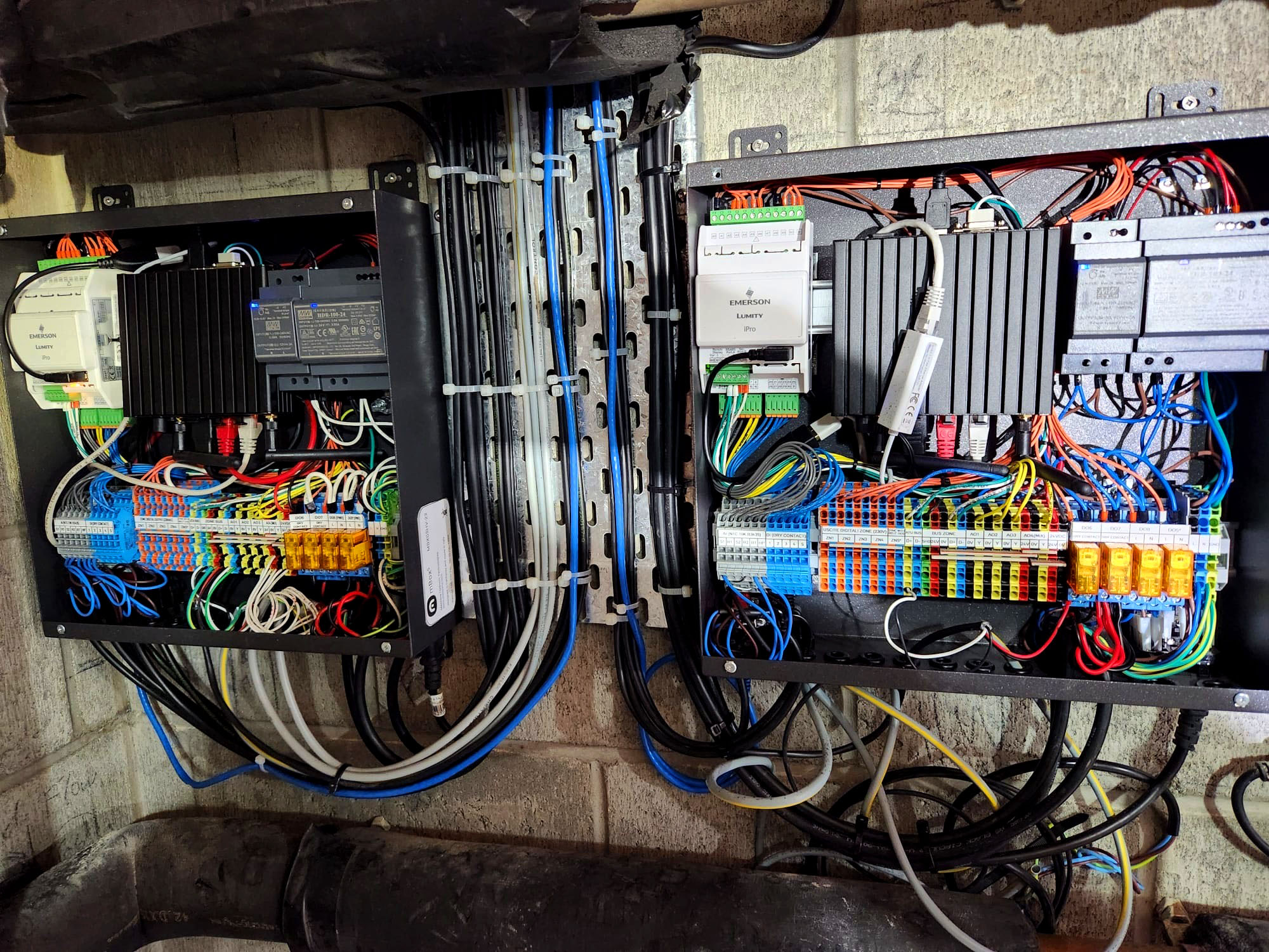 Two mBox5 hydronic controllers managing DHW and hydronic heating and cooling for an elderly village.