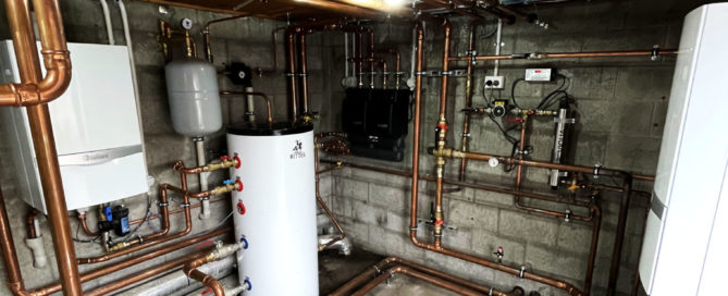 Rest home mechanical room used to provide radiant cooling/heating and domestic hot water.